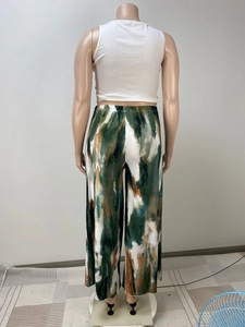 Detail of high waist elastic band on women's abstract print wide-leg pants back view