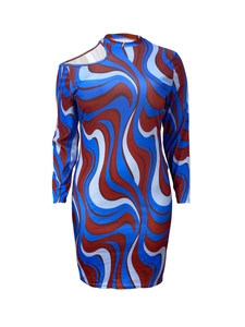 Detail of long sleeve mini dress featuring asymmetrical neckline and psychedelic print