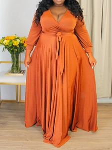 Plus size wrap V-neck maxi dress with long sleeves and adjustable waist tie in terracotta