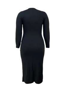 Rear view of a black slim fit long sleeve midi dress with smooth knitted fabric texture