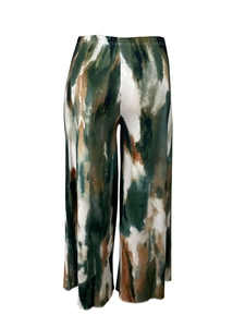 Detail of high-waist wide-leg pants featuring green and brown abstract ink print fabric