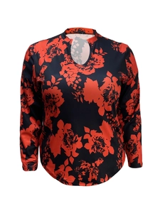Detail of V-neck keyhole neckline on black long sleeve top with red floral print