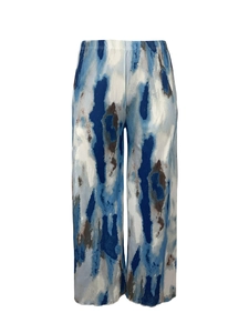 Detail of high waist plissé trousers featuring blue marble abstract tie-dye print pattern