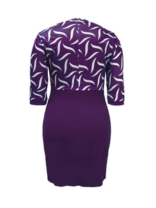 Back view of a purple floral patchwork dress featuring a crescent print and hidden zipper