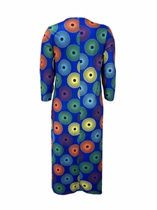 Detail view of African geometric circle print on a blue long sleeve maxi dress