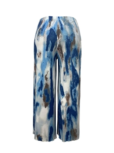 Detail of wide-leg trousers featuring abstract ink print and vertical pleated texture