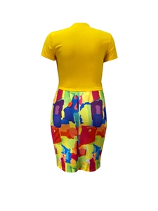 Detail view of colorful abstract print skirt and slim fit yellow round neck crop top