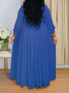 Back view of a deep blue plus size V-neck maxi dress with long sleeves and flowy hem