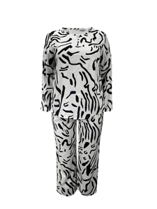 Detailed view of women's two-piece casual set featuring abstract black and white zebra pattern