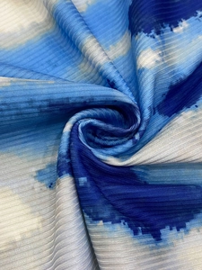 Macro shot of blue gradient tie-dye digital print fabric with striped texture