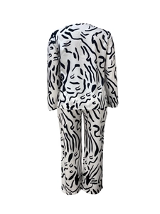 Back view of two-piece lounge set featuring black abstract zebra print on white fabric