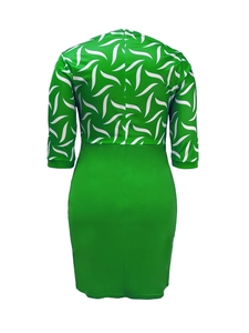 Detailed back view of a bodycon dress with green leaf pattern top and plain pencil skirt