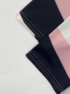 Close-up of geometric pattern stitching and durable double-needle seams on the sleeve