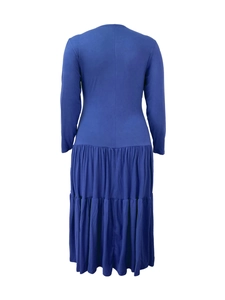 Rear view of long sleeve navy blue tiered dress with pleated design and elegant maxi length