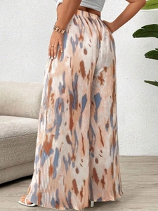 Detailed back view of high-waisted pleated wide-leg trousers with abstract ink print