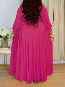 Back view of elegant fuchsia long sleeve maxi dress with flowing A-line silhouette