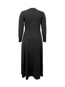 Rear view of minimalist black long-sleeve maxi dress with A-line skirt on white background