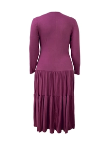 Rear view of magenta long sleeve dress with elegant tiered pleated skirt design
