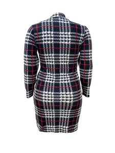 Detail view of long sleeve bodycon dress with black, white, and red plaid pattern