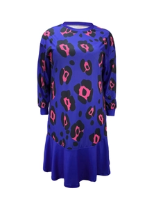 Detail of long sleeve dress featuring navy leopard print and ruffled hemline accents