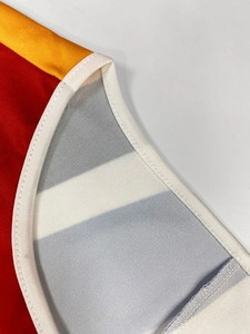 Macro detail of breathable mesh lining and contrast stitching on a casual loose dress
