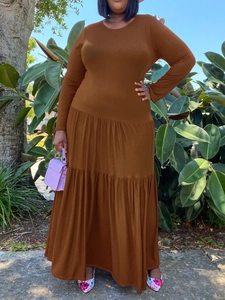 Elegant deep brown long sleeve tiered maxi dress featuring a comfortable round neckline