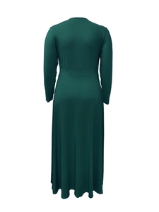 Rear view of long sleeve dark green maxi dress showing fitted waist and smooth texture