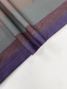 Detail of striped fabric with professional double-needle coverstitch on the hem