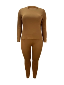 Detail of the slim fit long sleeve crewneck top and pants set in camel knit fabric