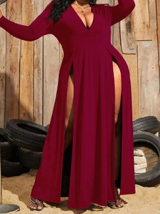 Detailed close-up of a burgundy V-neck maxi dress with high side slits and soft fabric