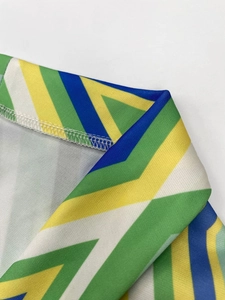 Detail of multi-color geometric striped knit fabric with professional overlock stitching