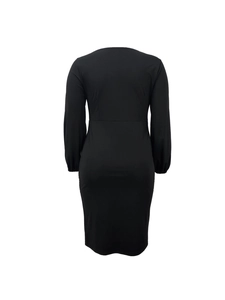 Rear view of a black long-sleeve slim-fit bodycon dress with minimalist round neckline