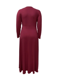 Back view of a waist-slimming plus size burgundy maxi dress with premium draping texture