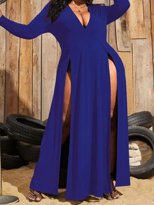 Detail of royal blue maxi dress featuring a deep V-neck and high side slits on fabric