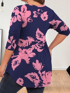 Detail view of navy blue floral print blouse with pleated high waist and loose hem