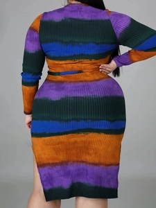 Detail view of the ribbed knit fabric and multi-color tie-dye print on a long sleeve dress