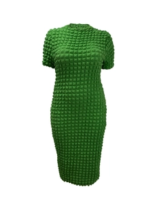 Detail of emerald green popcorn texture fabric on a short sleeve bodycon midi dress