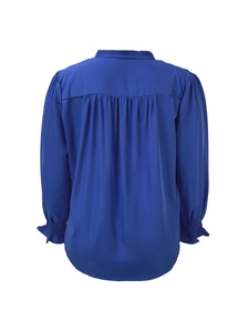 Detail of dark blue long sleeve blouse showing back pleated design and smocked cuffs