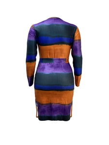 Detail of ribbed knit dress featuring vibrant purple and orange tie-dye stripes and waist tie