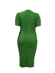 Detail of green bubble textured fabric on a short sleeve bodycon midi dress
