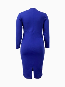 Macro detail of royal blue slim fit dress featuring back seam and elegant slit hemline