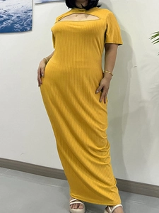 Detail of yellow knit maxi dress featuring short sleeves and hollow out chest cutout