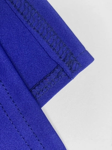 Detailed close-up showing reinforced stitching and breathable navy blue fabric texture
