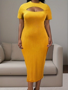 Detail of bright yellow ribbed knit dress featuring unique chest cutout and short sleeves