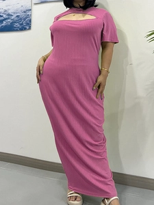 Detail of rose pink ribbed knit maxi dress featuring cut-out neckline and slim fit