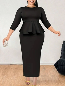 Detail view of the black peplum top with 3/4 sleeves and high-waist bodycon skirt set