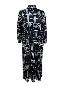 Detail of long sleeve shirt dress featuring black and white abstract geometric prints