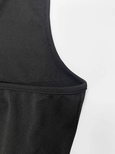 Detailed view of the double-needle stitching on black cape dress elastic fabric