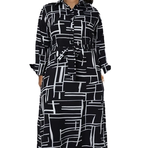 Women's long sleeve maxi shirt dress with geometric black and white grid pattern and waist tie