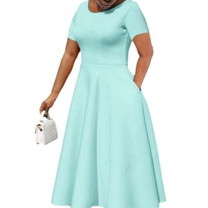 Elegant mint green short sleeve A-line dress with side pockets and a round neckline